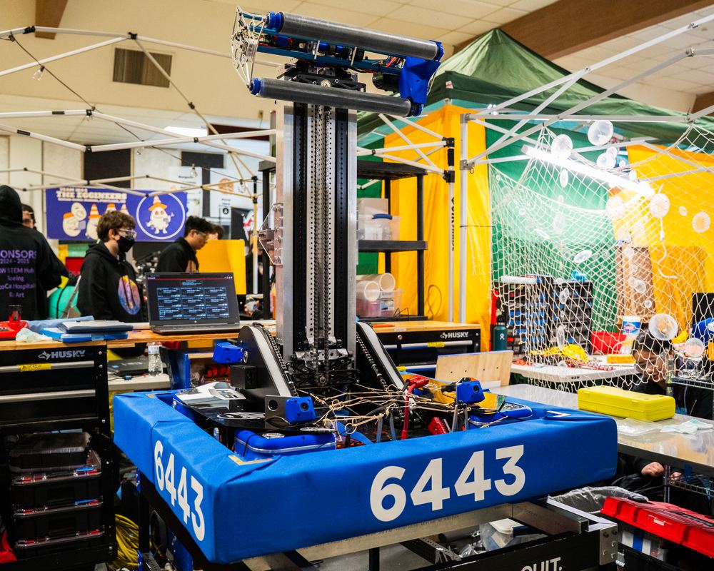 The built 2025 robot in the pit with the elevator extended and the end effector at the top