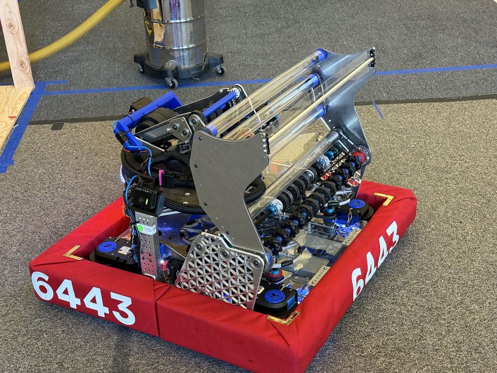 The built 2026 robot in the pit showing the turret, indexer rollers and polycarbonate guides