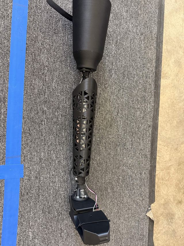 The assembled prototype showing the printed shell, spring-loaded ankle and sensor wiring